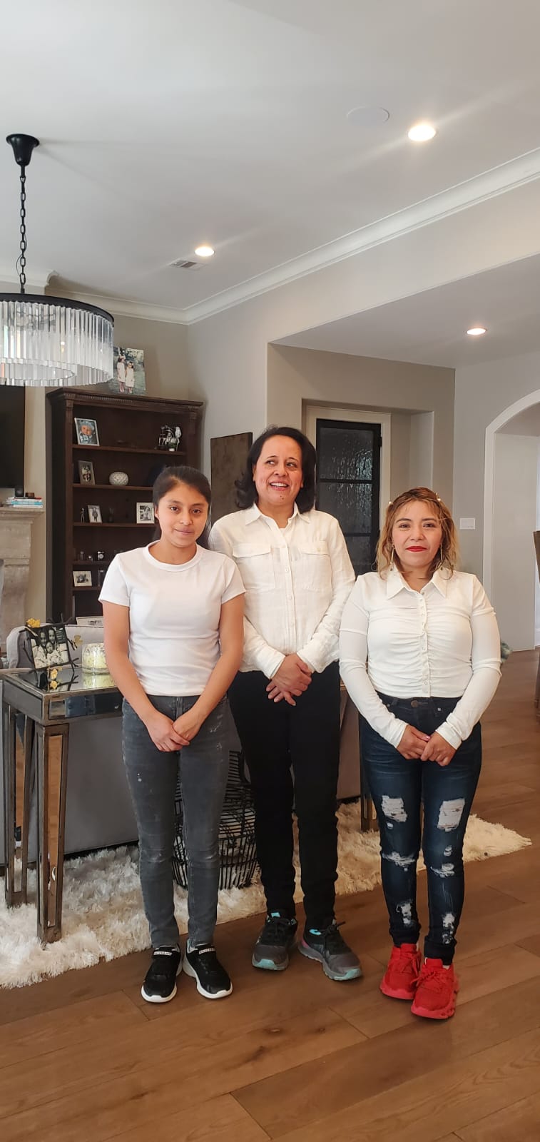 The Glory Clean cleaning team of three at a client's home in Houston, TX
